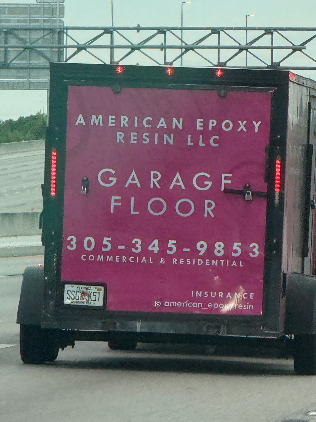 American Epoxy Resin LLC work vehicle displaying its business signage and contact information