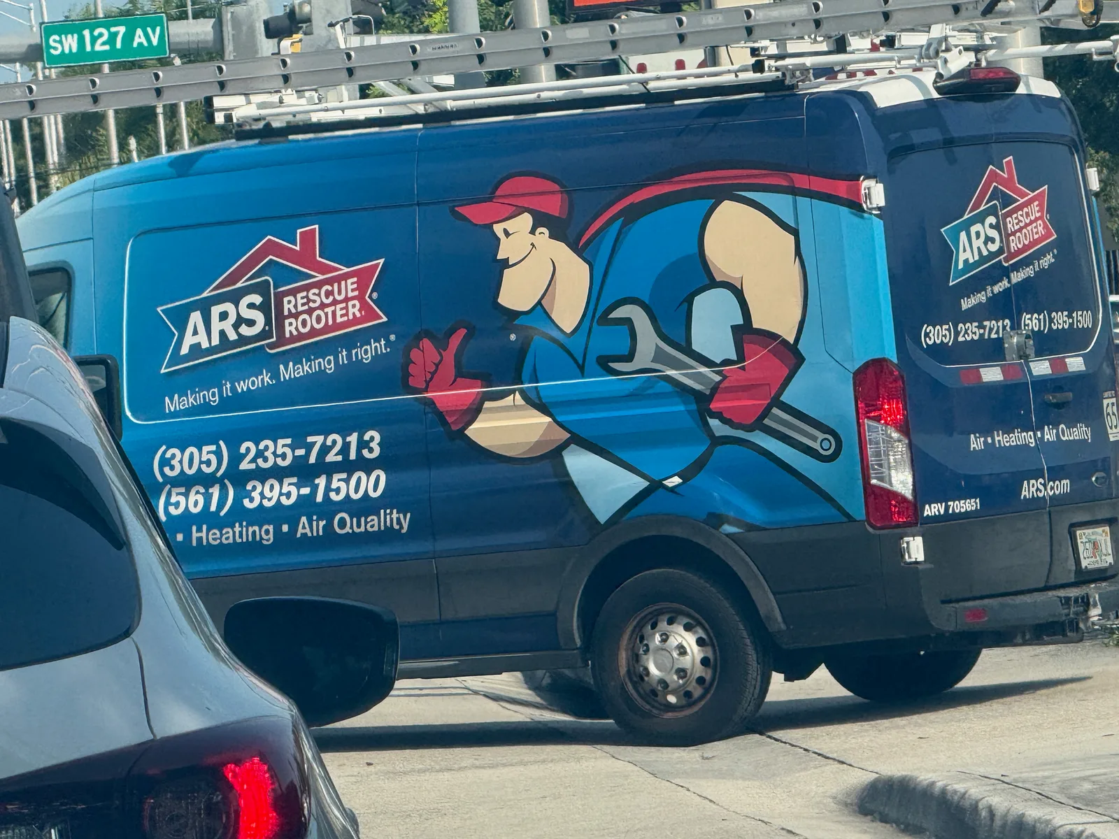 ARS / Rescue Rooter Miami work vehicle displaying services and contact details