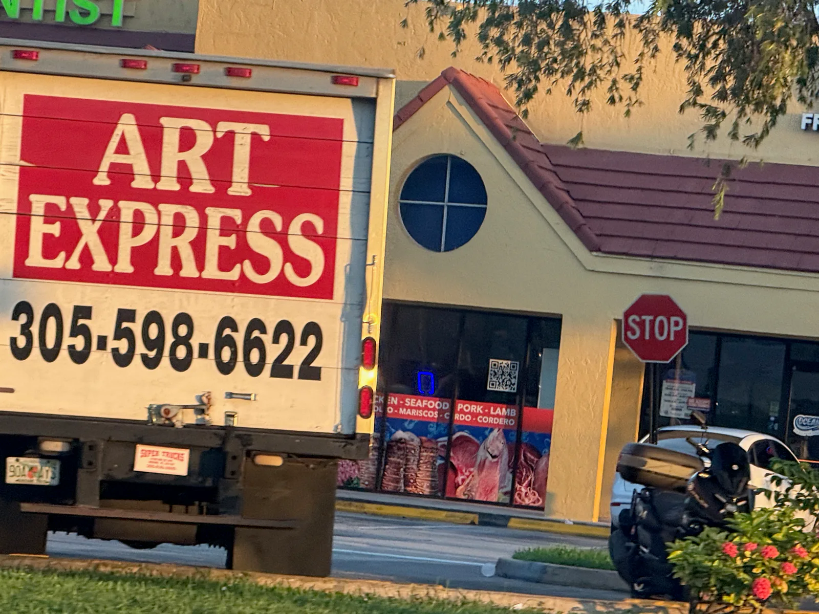 Art Express delivery truck displaying phone number 305-598-6622