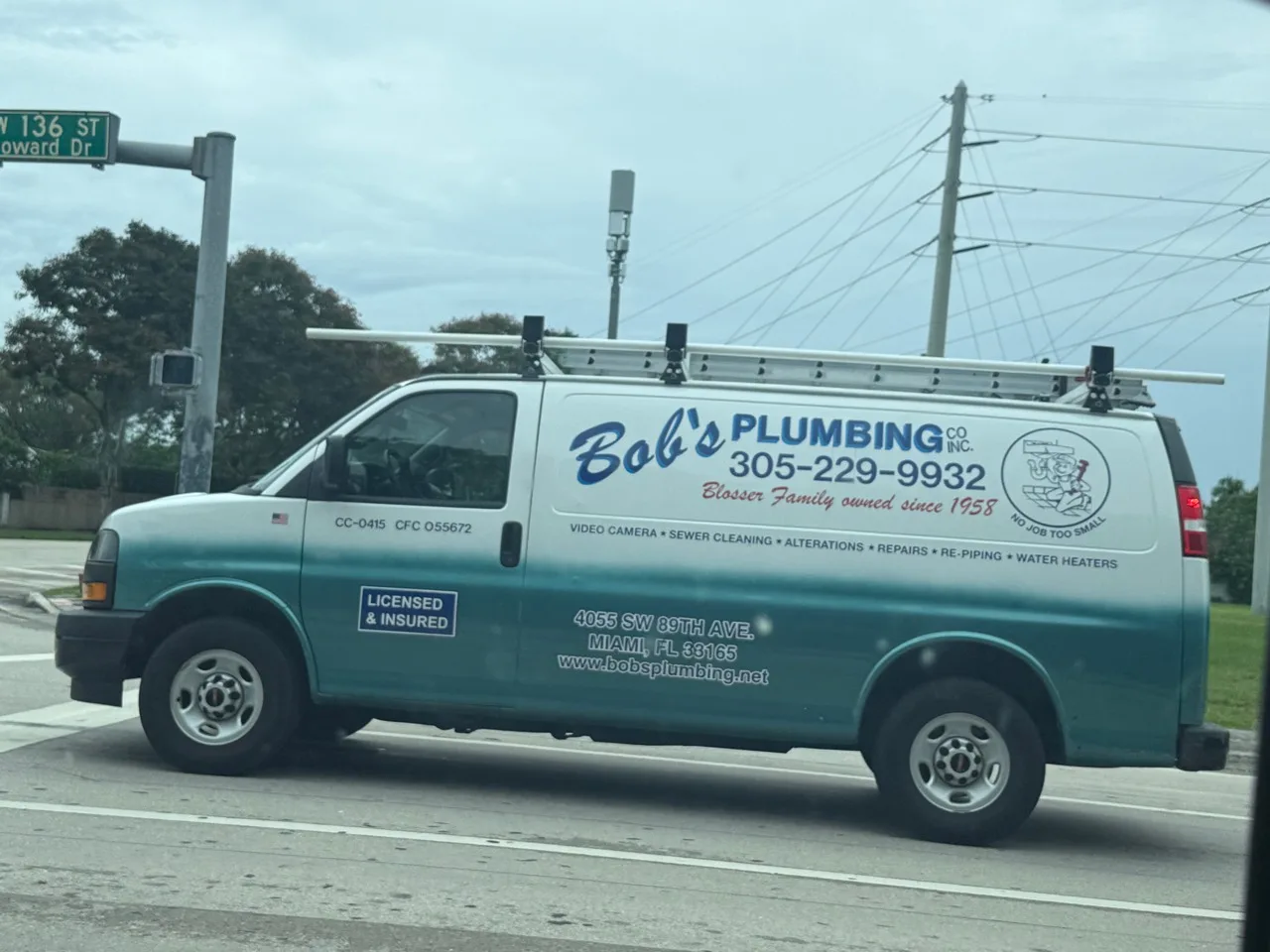 Bob's Plumbing Co. Inc. work vehicle displaying business services and contact information