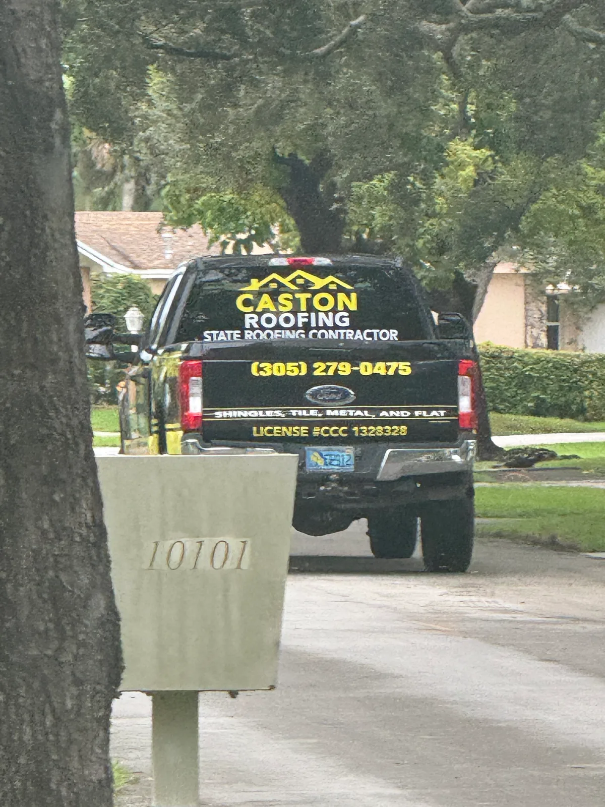 Caston Roofing work vehicle displaying its business name and contact information