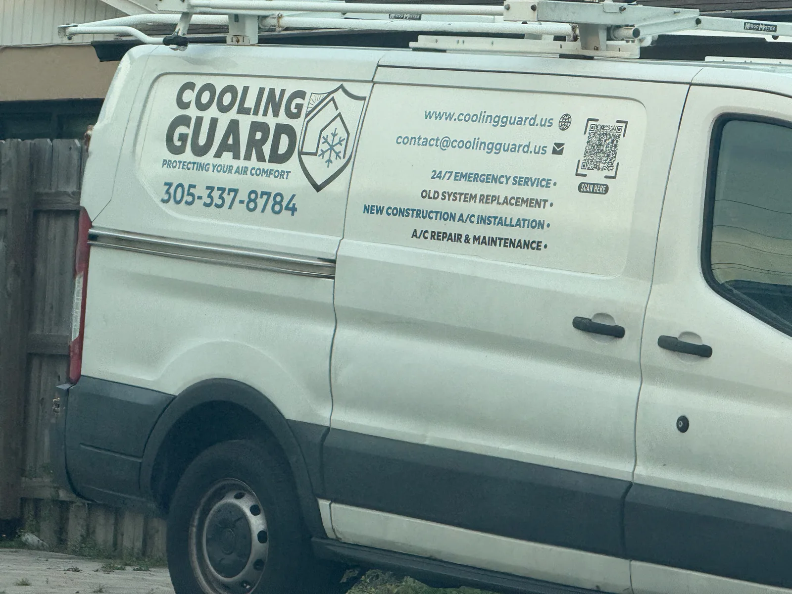 Cooling Guard HVAC van displaying phone number 305-337-8784, coolingguard.us, and emergency, installation, repair, and maintenance services