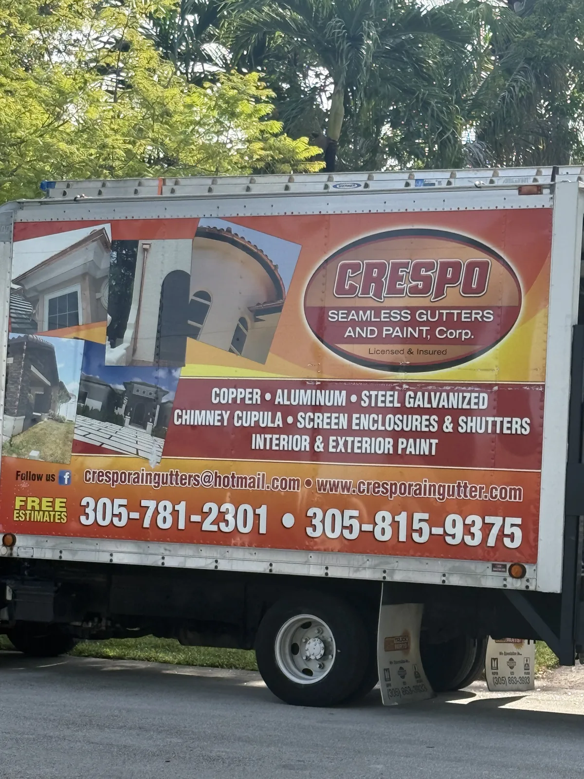 Orange Crespo Seamless Gutters and Paint work truck showing gutter services and contact details — photo 1 of 2