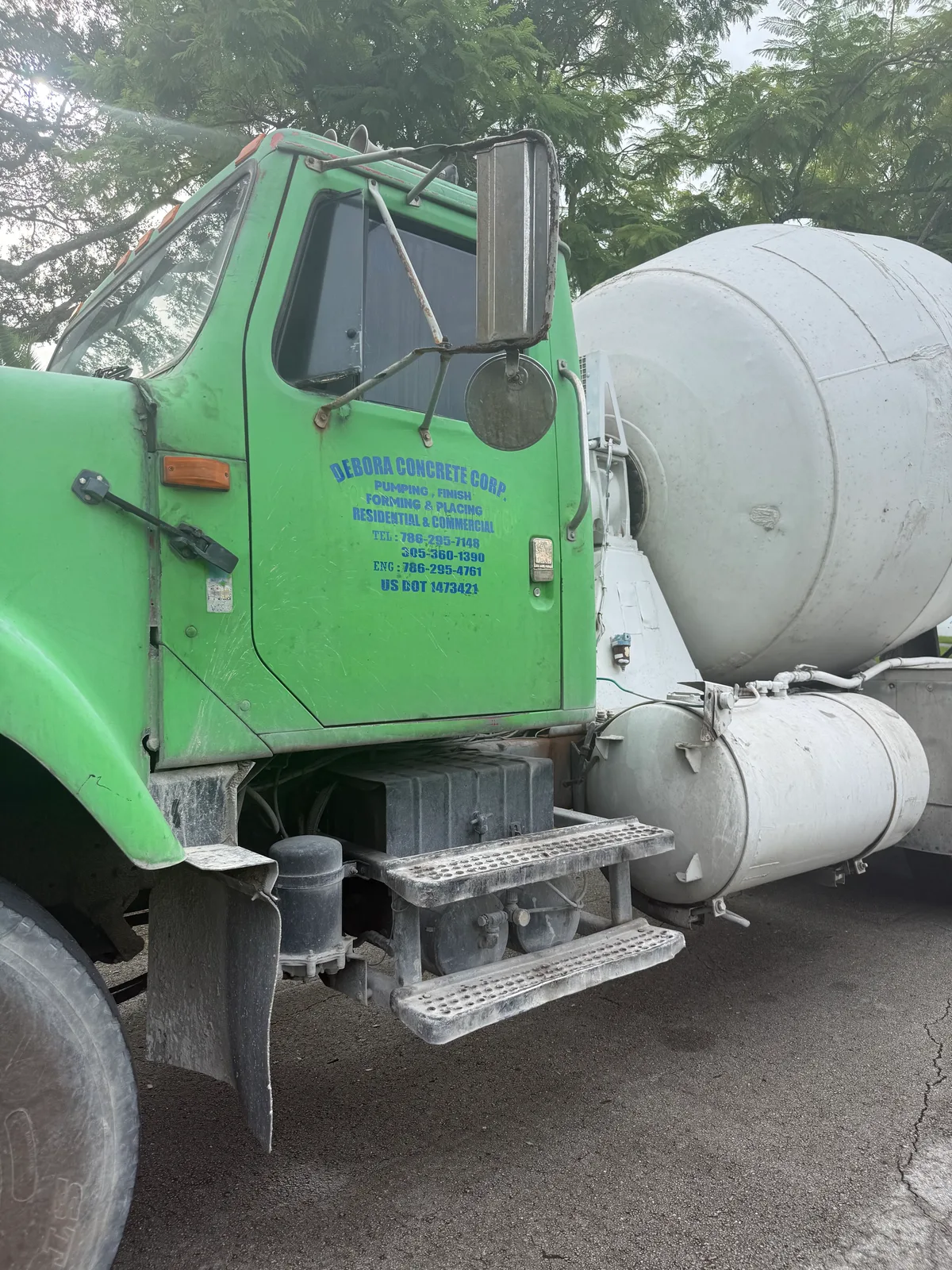 Debora Concrete Corp. work vehicle displaying business services and contact information