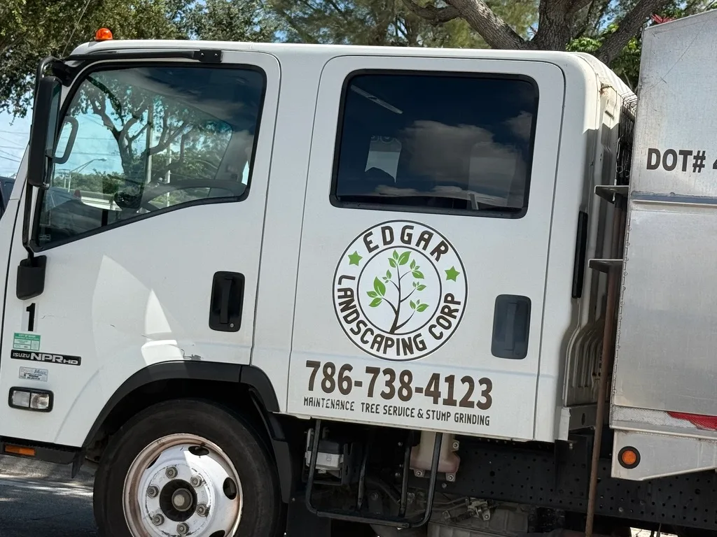 Edgar Landscaping Corp. work vehicle showing business branding and phone