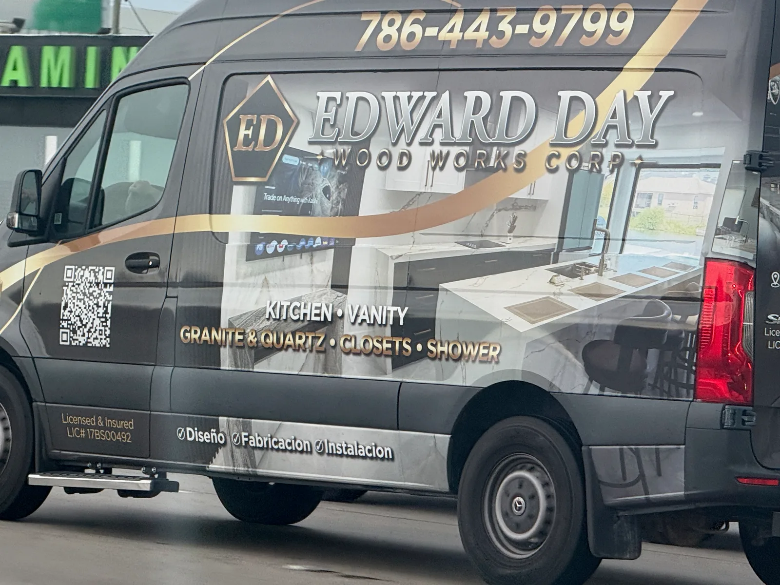 Edward Day Wood Works Corp. work vehicle displaying its business signage and contact information