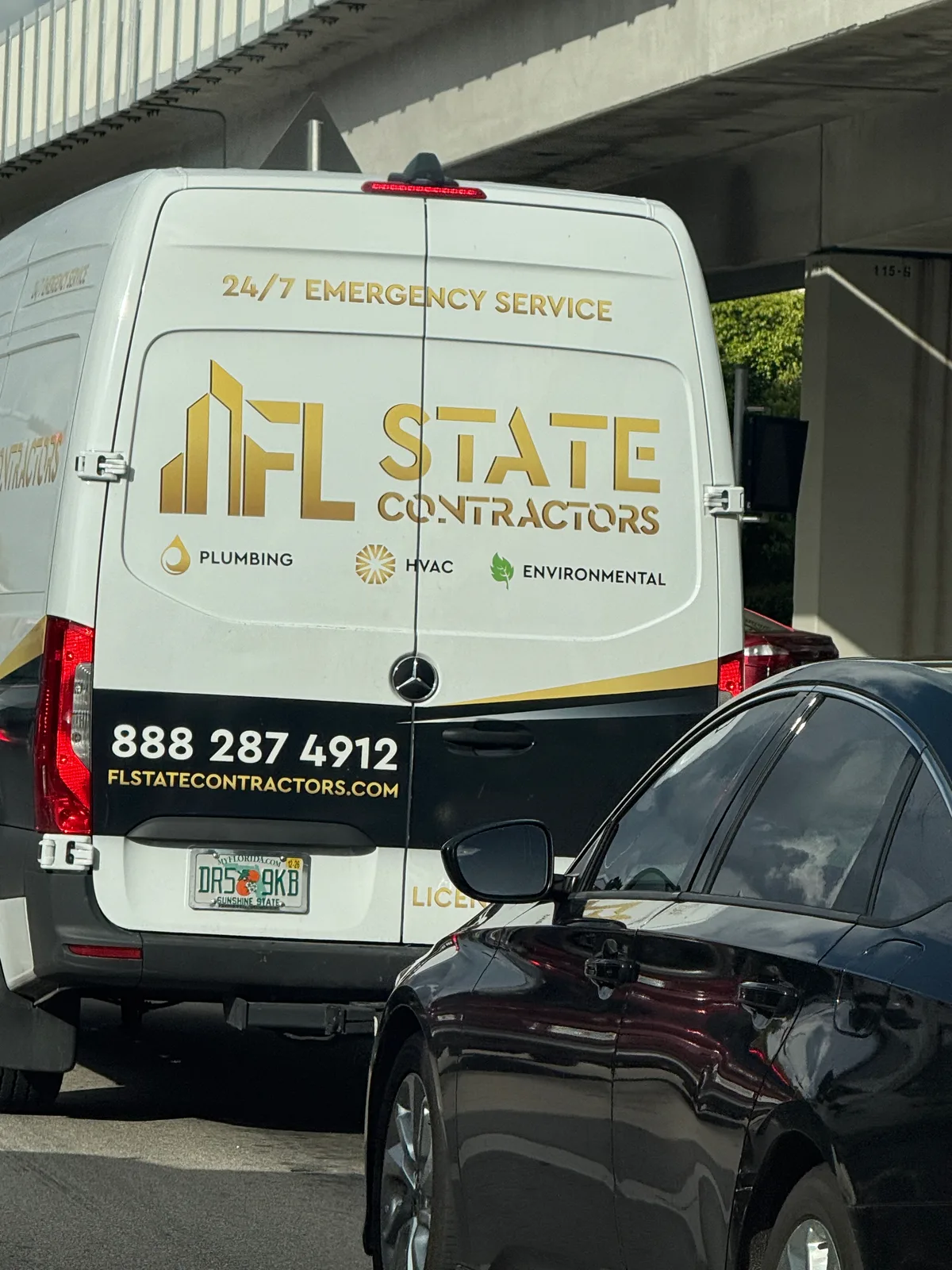 FL State Contractors van advertising 24-hour plumbing, HVAC, and environmental service at 888-287-4912