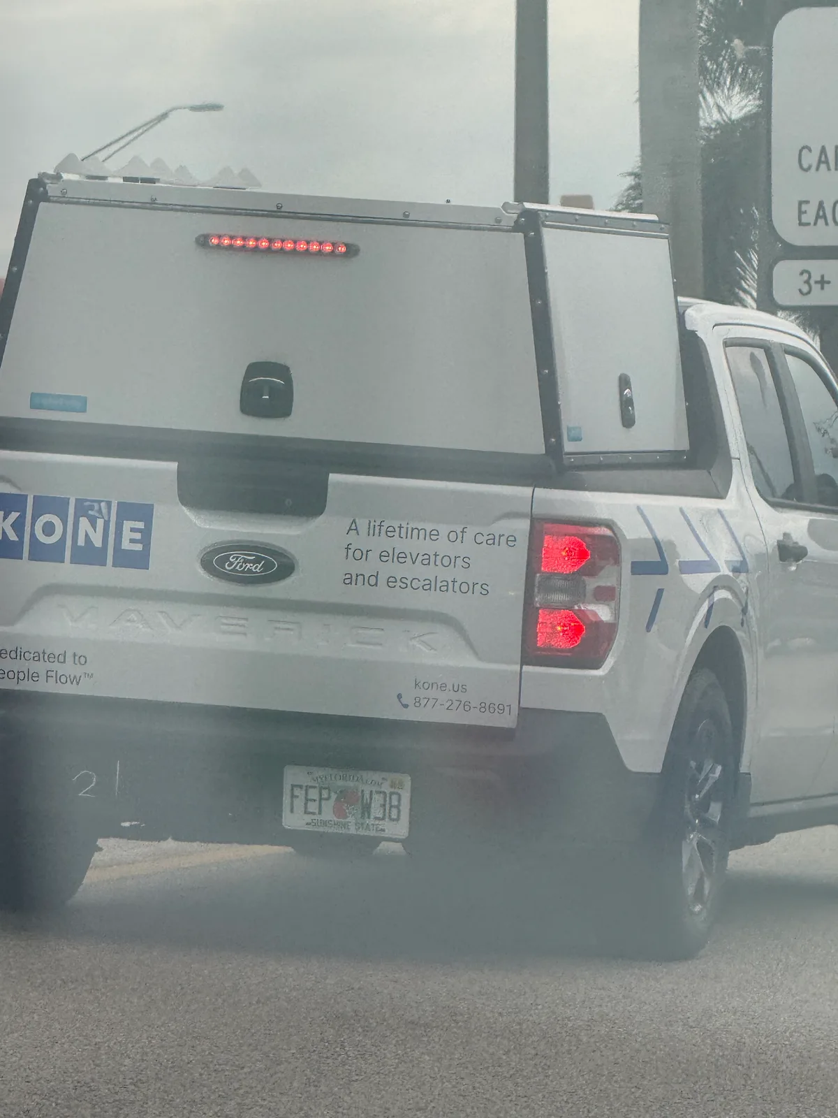 KONE Miami work vehicle displaying business contact information