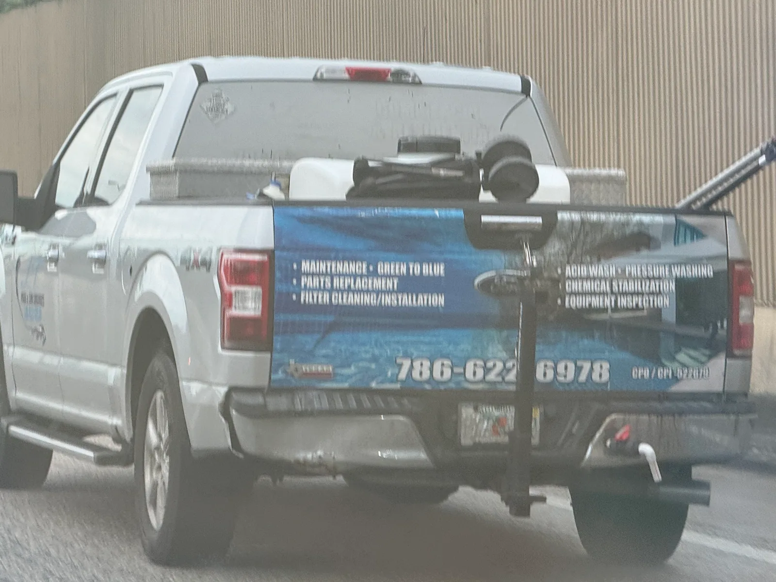 LT Pool & Spa Services work vehicle displaying its business name and contact information — photo 3 of 3