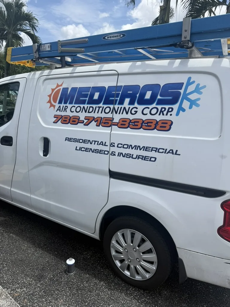 White Mederos Air Conditioning Corp van advertising residential and commercial service