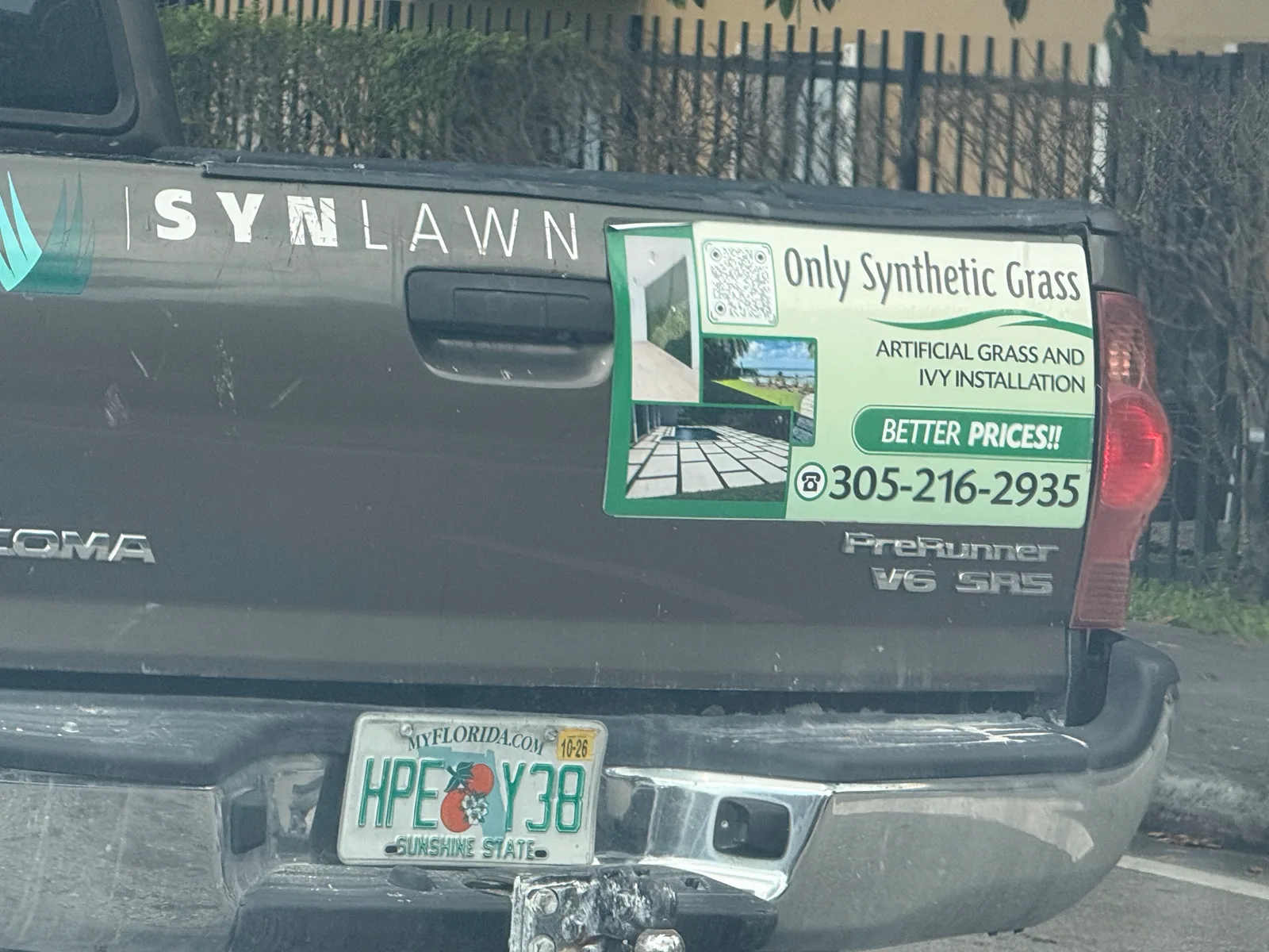 Only Synthetic Grass work vehicle displaying services and contact details
