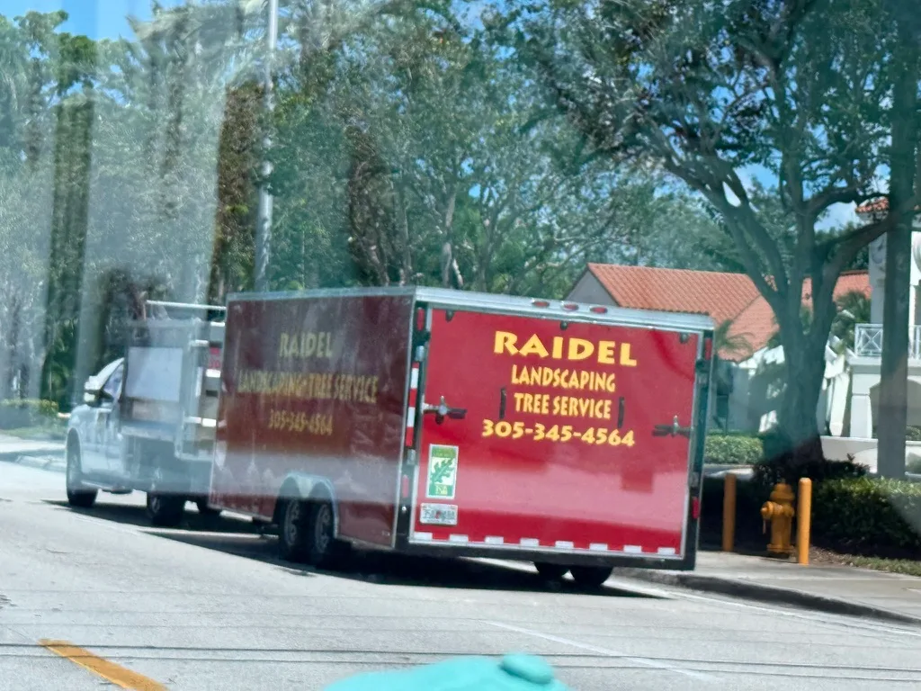 Raidel Landscaping work vehicle showing business branding and phone