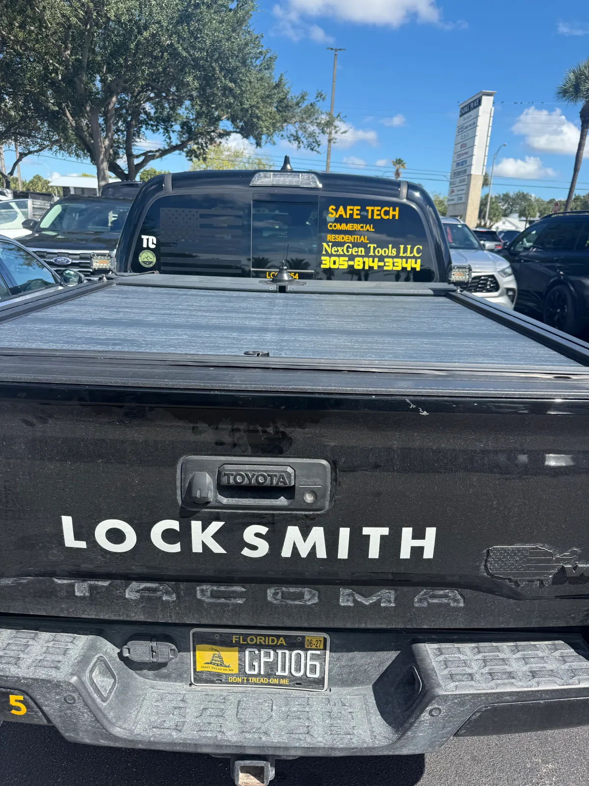 Black Safe Tech and NexGen Tools LLC pickup advertising residential and commercial locksmith services and phone 305-814-3344