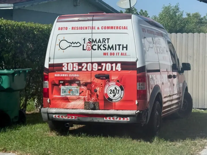 Wrapped 1 Smart Locksmith van displaying phone number 305-209-7014 and emergency locksmith services