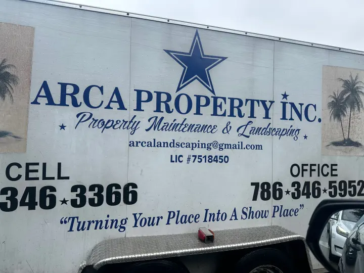 Arca Property Inc. work vehicle displaying its business signage and contact information