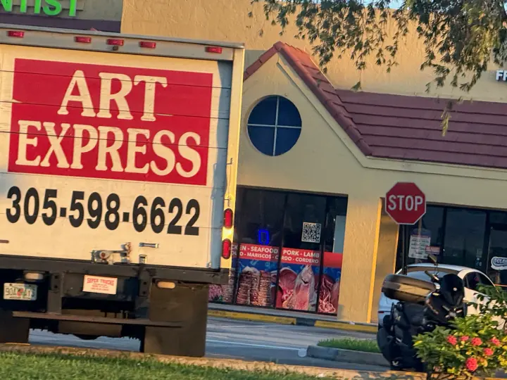 Art Express delivery truck displaying phone number 305-598-6622