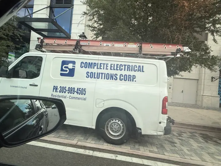 Complete Electrical Solutions Corp van displaying phone number 305-989-4505 and residential-commercial wording