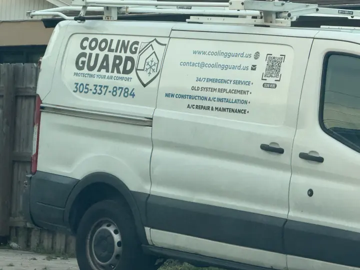 Cooling Guard HVAC van displaying phone number 305-337-8784, coolingguard.us, and emergency, installation, repair, and maintenance services