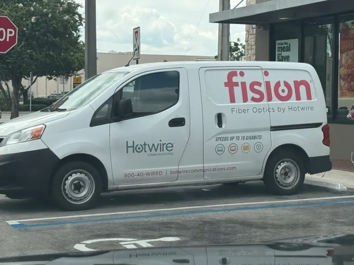 Fision by Hotwire service vehicle advertising fiber-optic internet and 800-40-WIRED