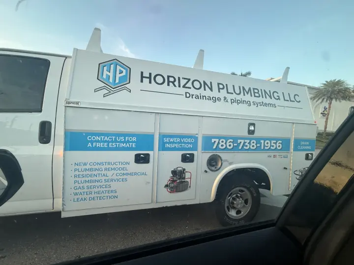 Horizon Plumbing LLC work vehicle displaying its business signage and contact information