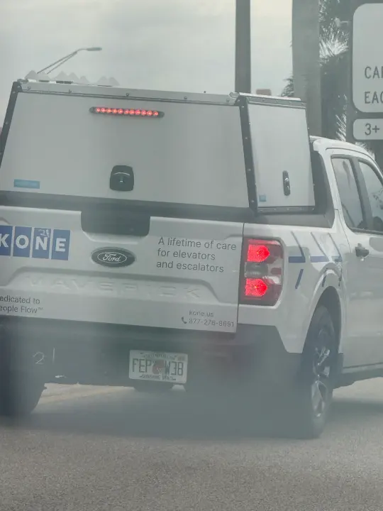 KONE Miami work vehicle displaying business contact information