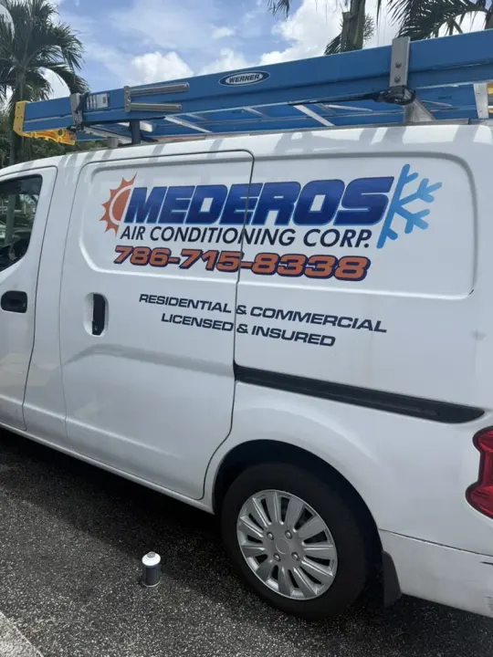 White Mederos Air Conditioning Corp van advertising residential and commercial service