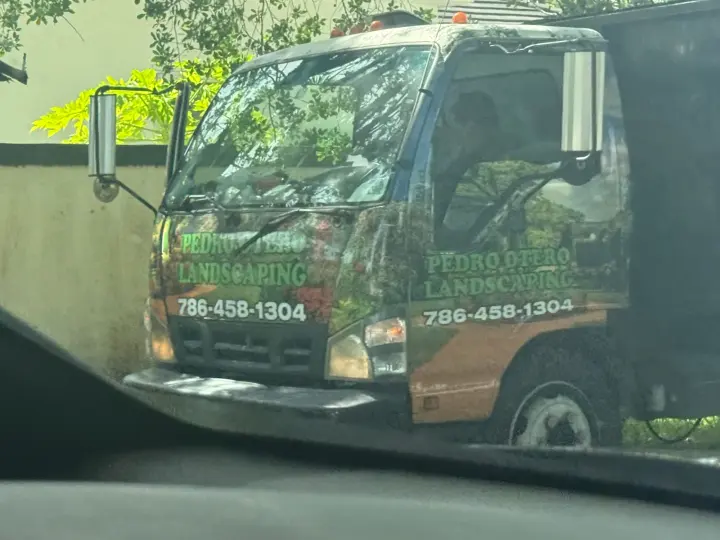 Pedro's Tree Service work truck displaying landscaping and tree-service text and phone number 786-458-1304