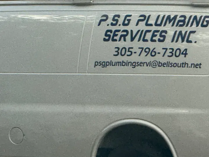 P.S.G. Plumbing Services vehicle displaying phone number 305-796-7304 and a Bellsouth email address