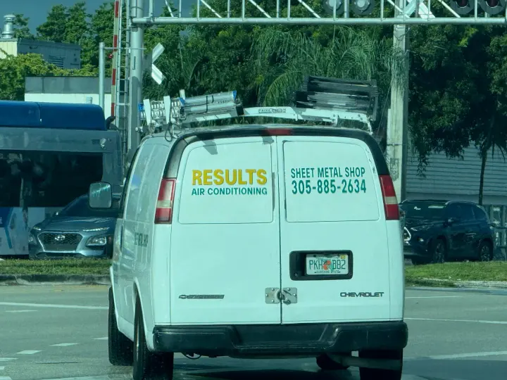 Results Air Conditioning sheet-metal shop van displaying phone number 305-885-2634