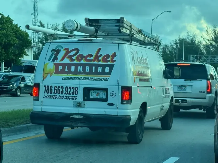 Rocket Plumbing commercial and residential service van displaying phone number 786-663-9238