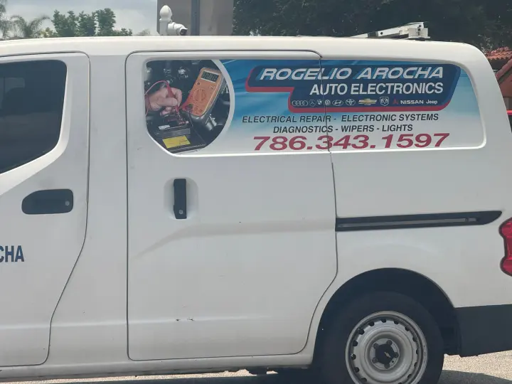 Rogelio Arocha Auto Electronics service van displaying phone number 786-343-1597 and automotive electrical services
