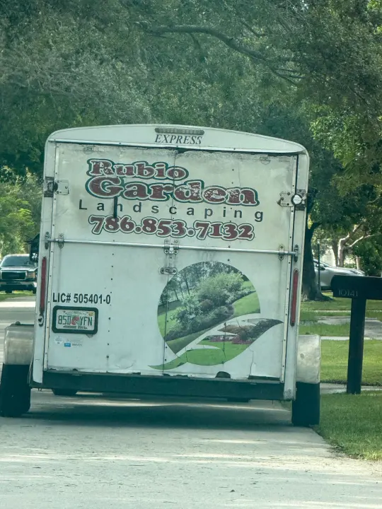 Rubio Garden LLC work vehicle displaying its business signage and contact information