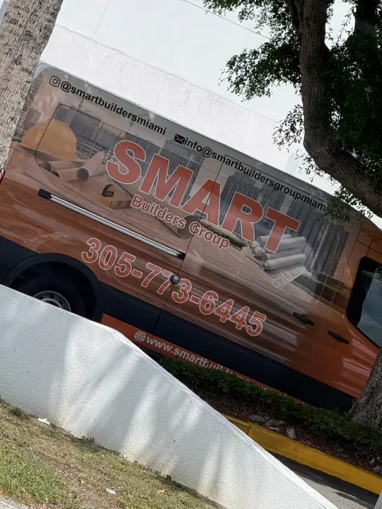 Smart Builders Group contractor vehicle displaying phone, email, website, and Instagram contact information
