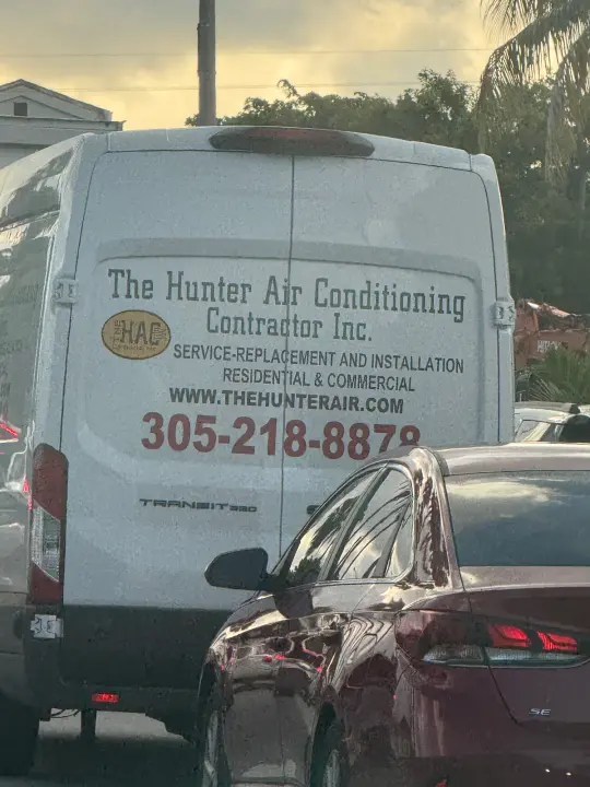 The Hunter Air Conditioning Contractor van displaying thehunterair.com and phone number 305-218-8879