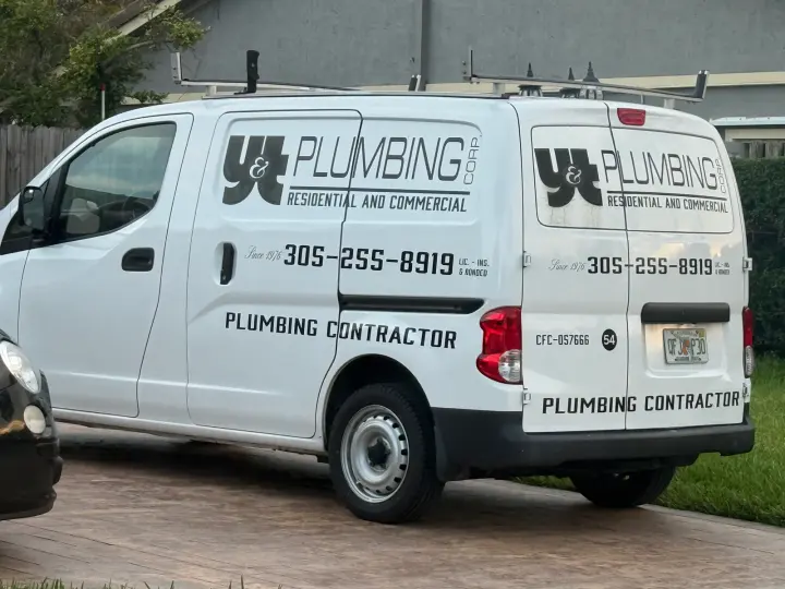 Y&T Plumbing Corp residential and commercial plumbing van displaying phone number 305-255-8919 and license CFC057666