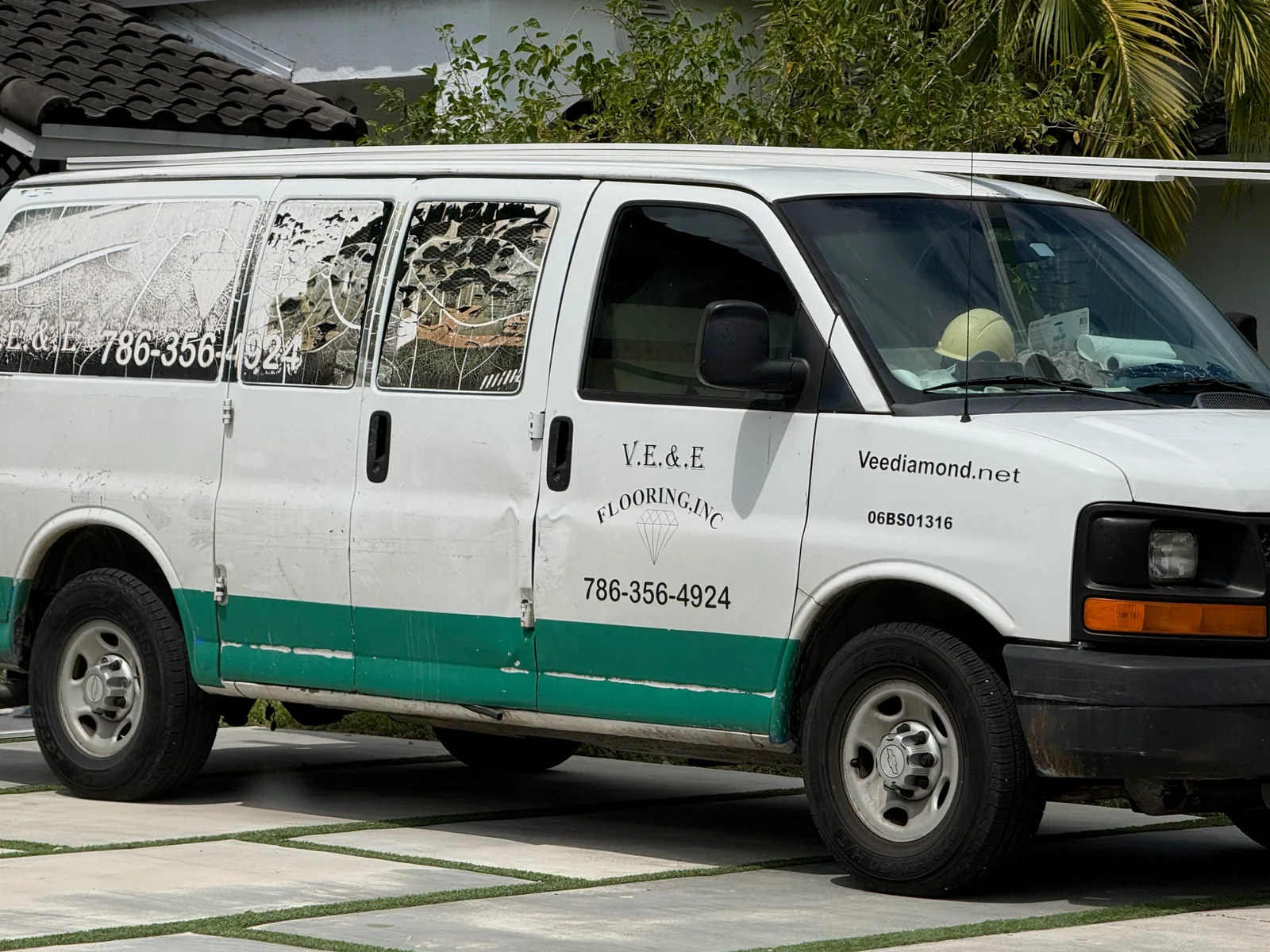 V.E. & E. Flooring work vehicle displaying phone number 786-356-4924 and Veediamond.net
