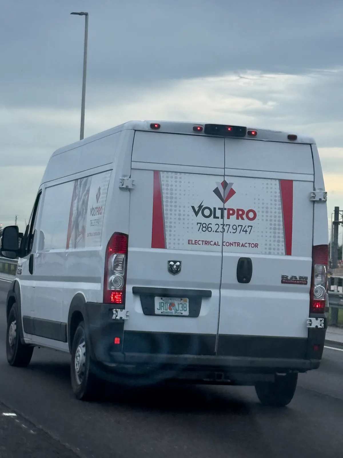 Voltpro Electrical Contractors work vehicle displaying its business signage and contact information